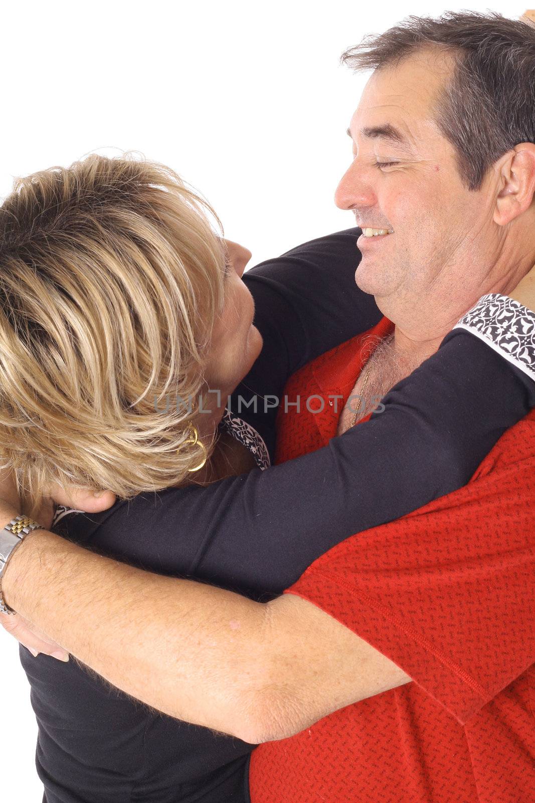 shot of a romantic couple in love hugging each other by creativestock