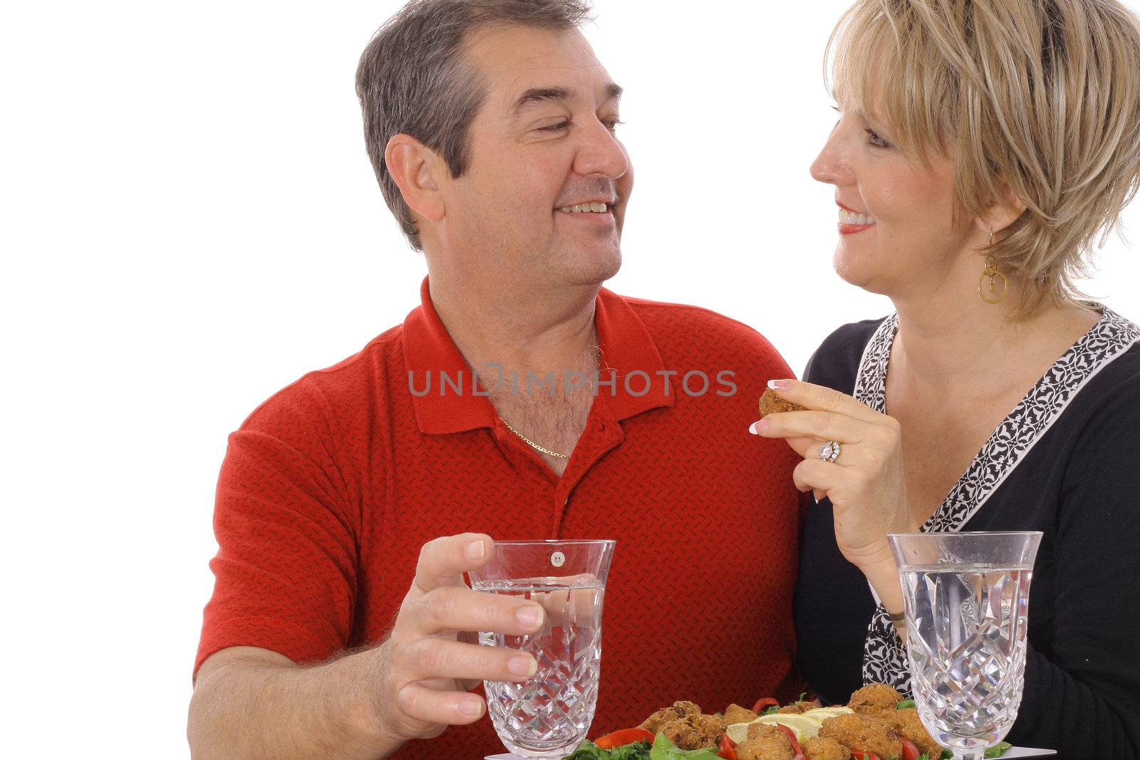 middle aged couple having appetizers