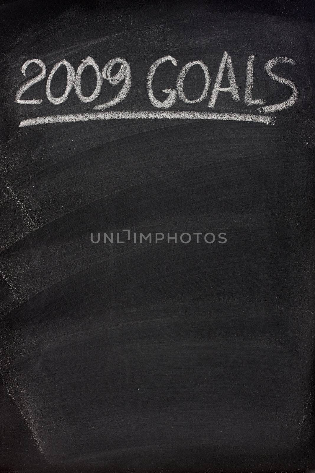 2009 goals title handwritten with white chalk on blackboard with copy space below for New Year tasks and resolutions