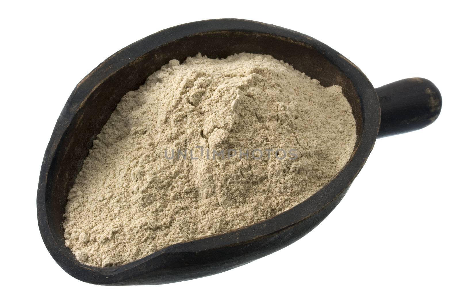gluten free buckwheat flour on a rustic wooden scoop, isolated on white