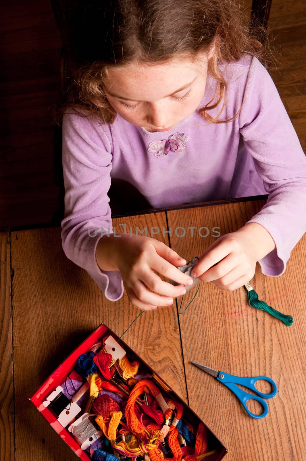 young girl sewing by rongreer