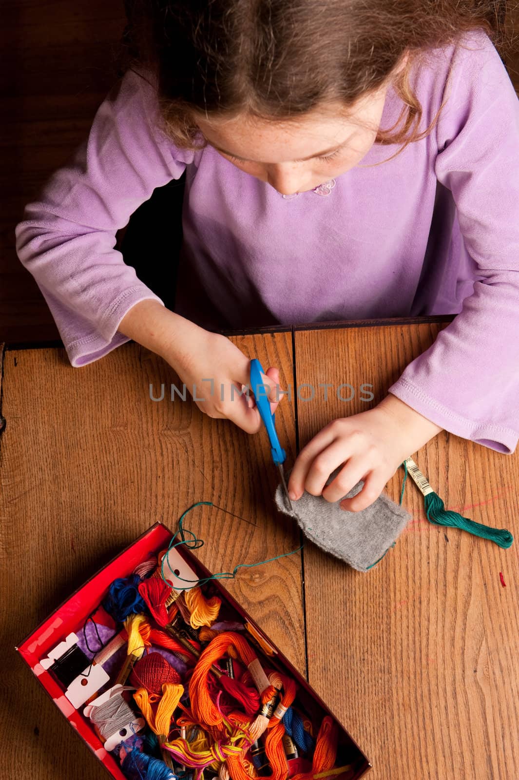 young girl sewing by rongreer