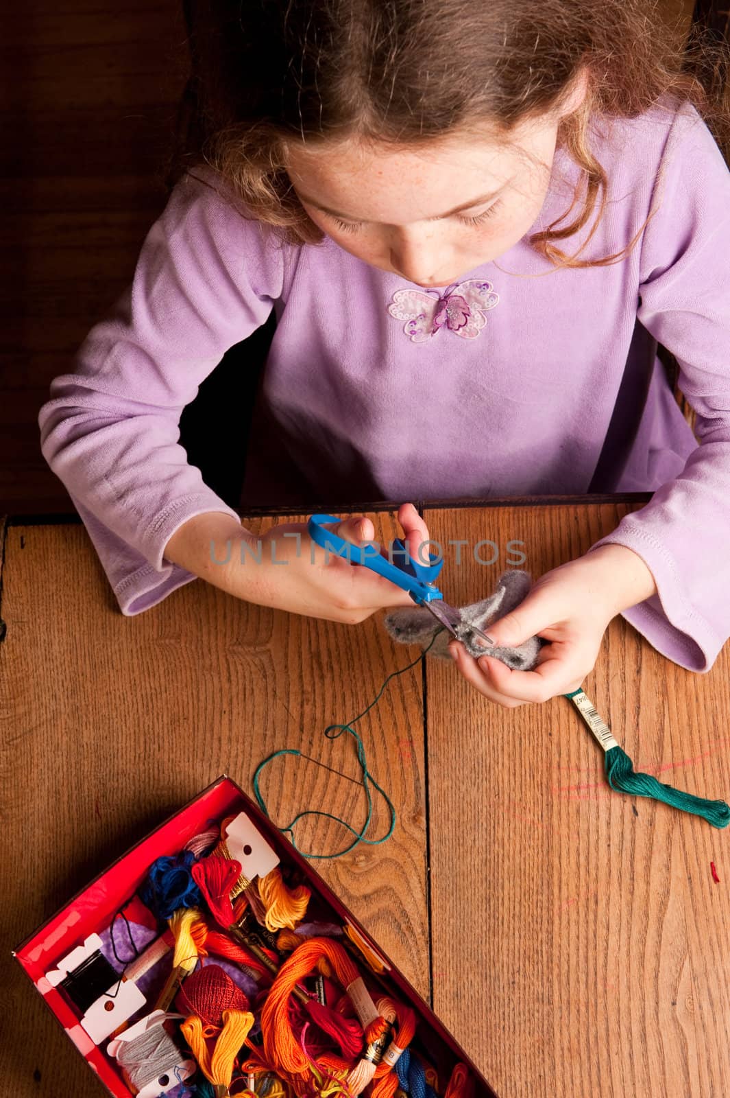 young girl sewing by rongreer