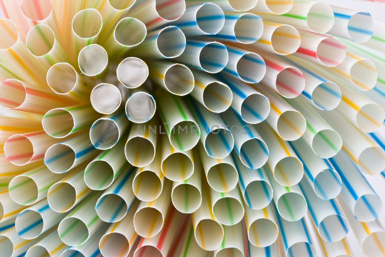 closeup of colorful drinking straws by bernjuer