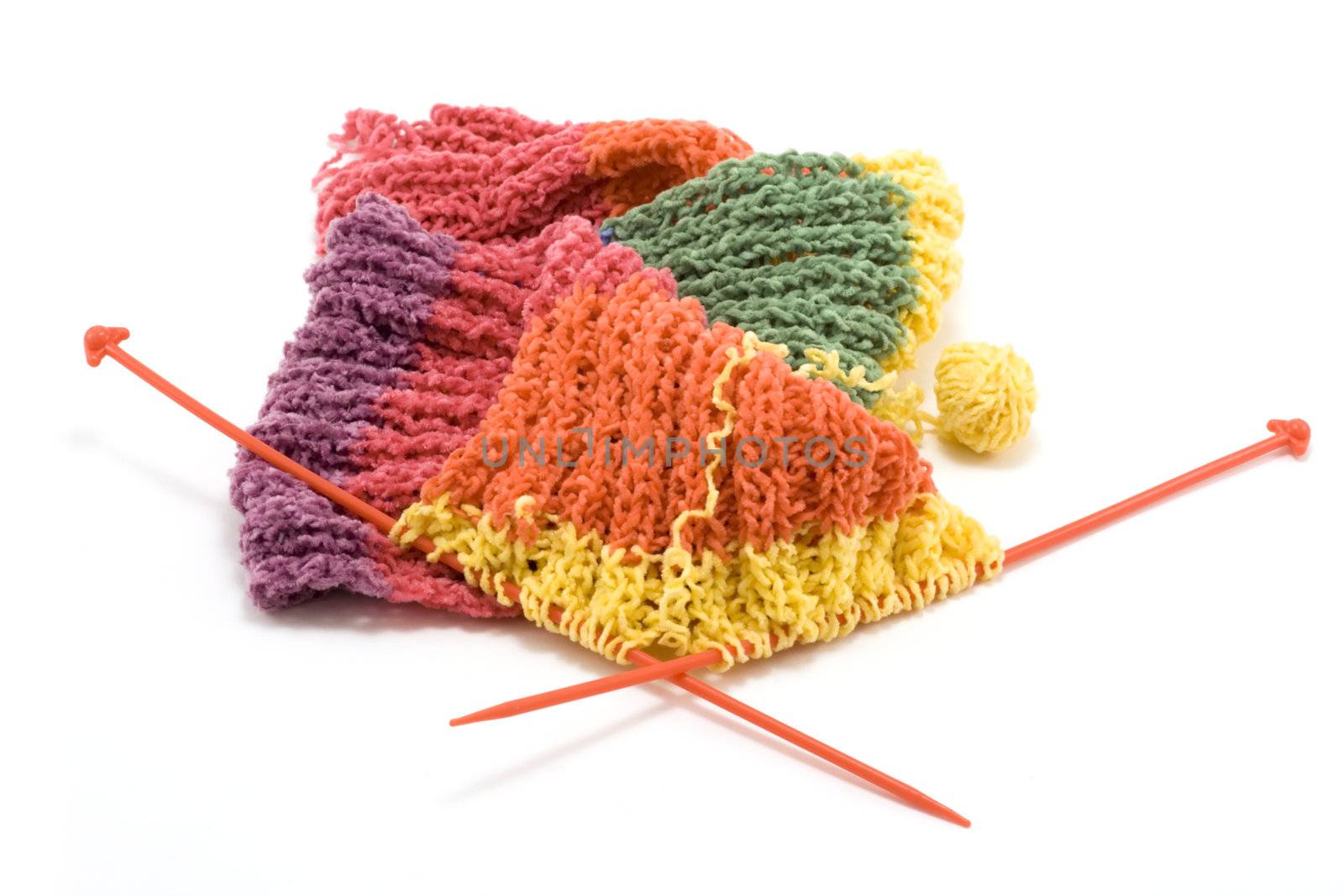 Knitted colour scarf, wool, spokes on white background