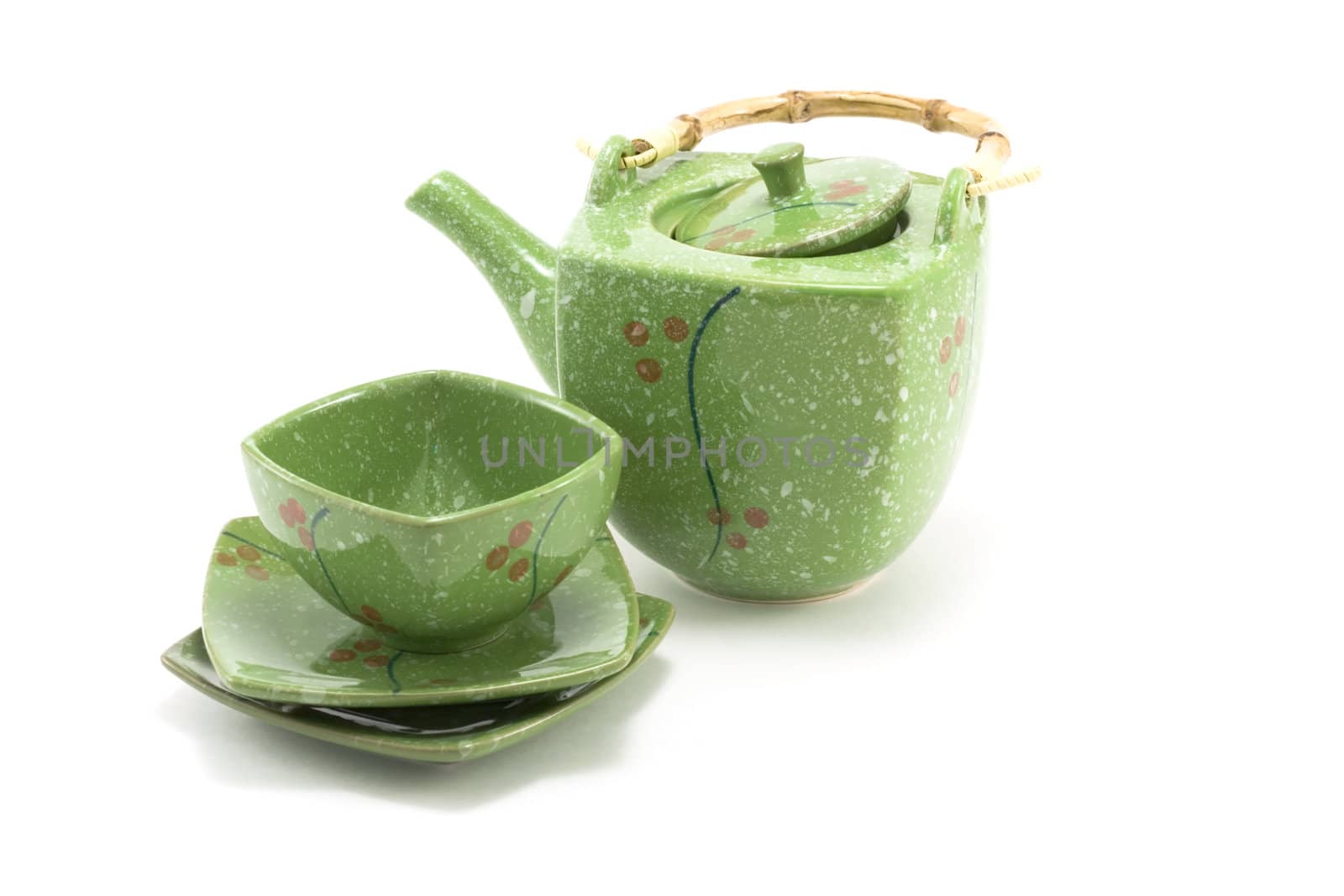 Chinese teapot with bamboo handle and cup insulated on white background