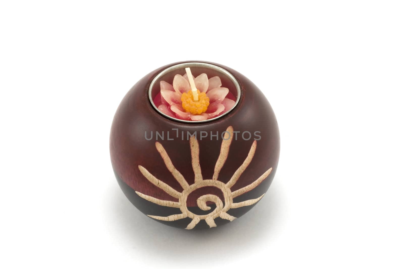 Candlesticks, wooden balls with candle on white background