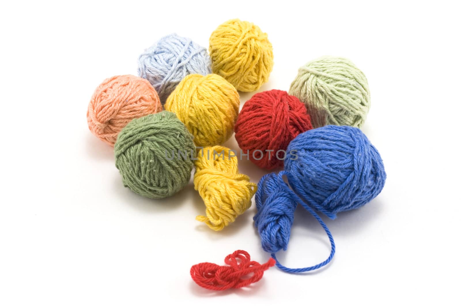 Ball of the colour threads insulated on white background