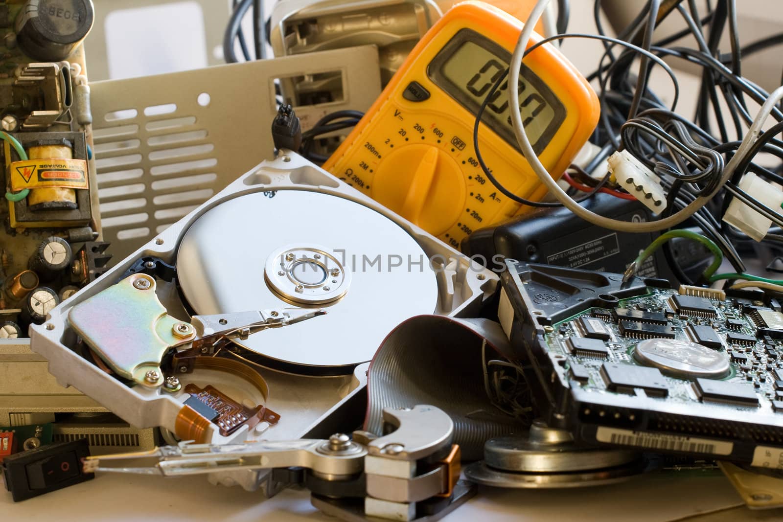 Pile of Old computer parts and hard disks