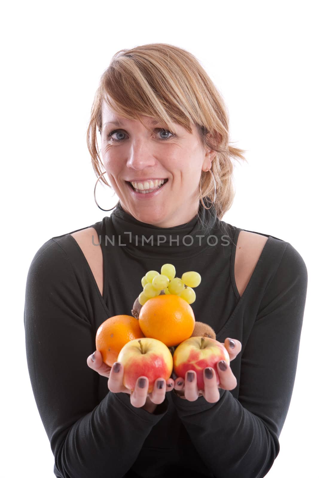 Young modern woman with her hands full of fruit