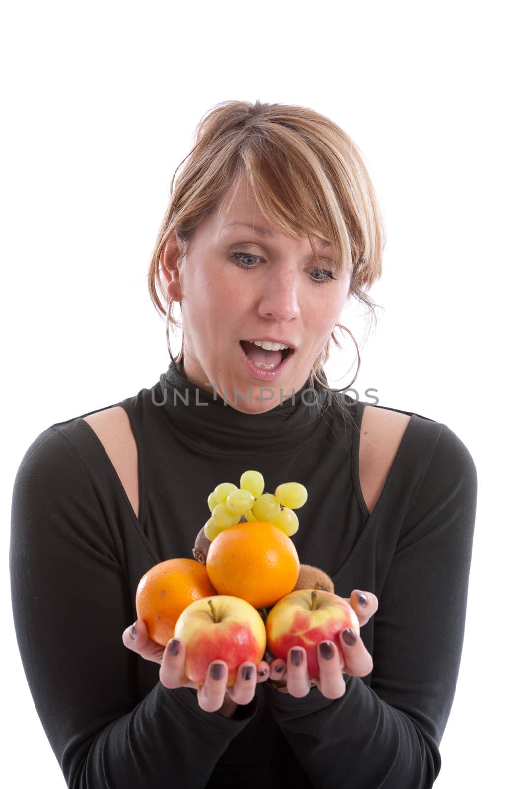 Pretty blond girl with her hands full of fruit