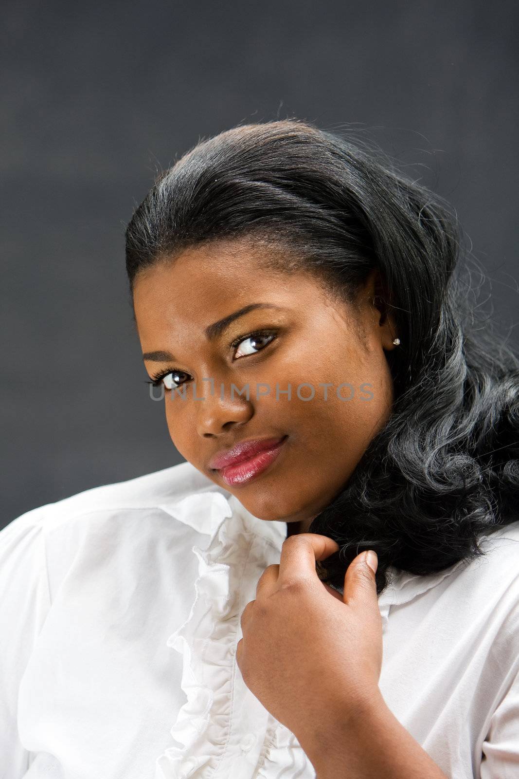 Portrait of a beautiful African-America woman in white shirt