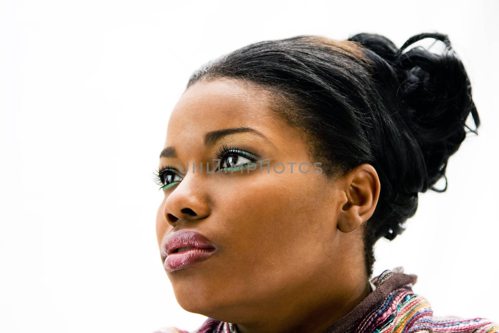 Face of a beautiful African American woman with colorful scarf, isolated