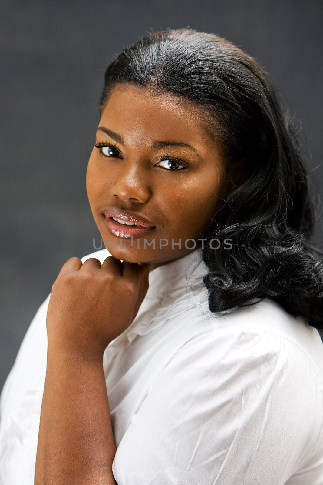 Portrait of a beautiful African-America woman in white shirt, isolated