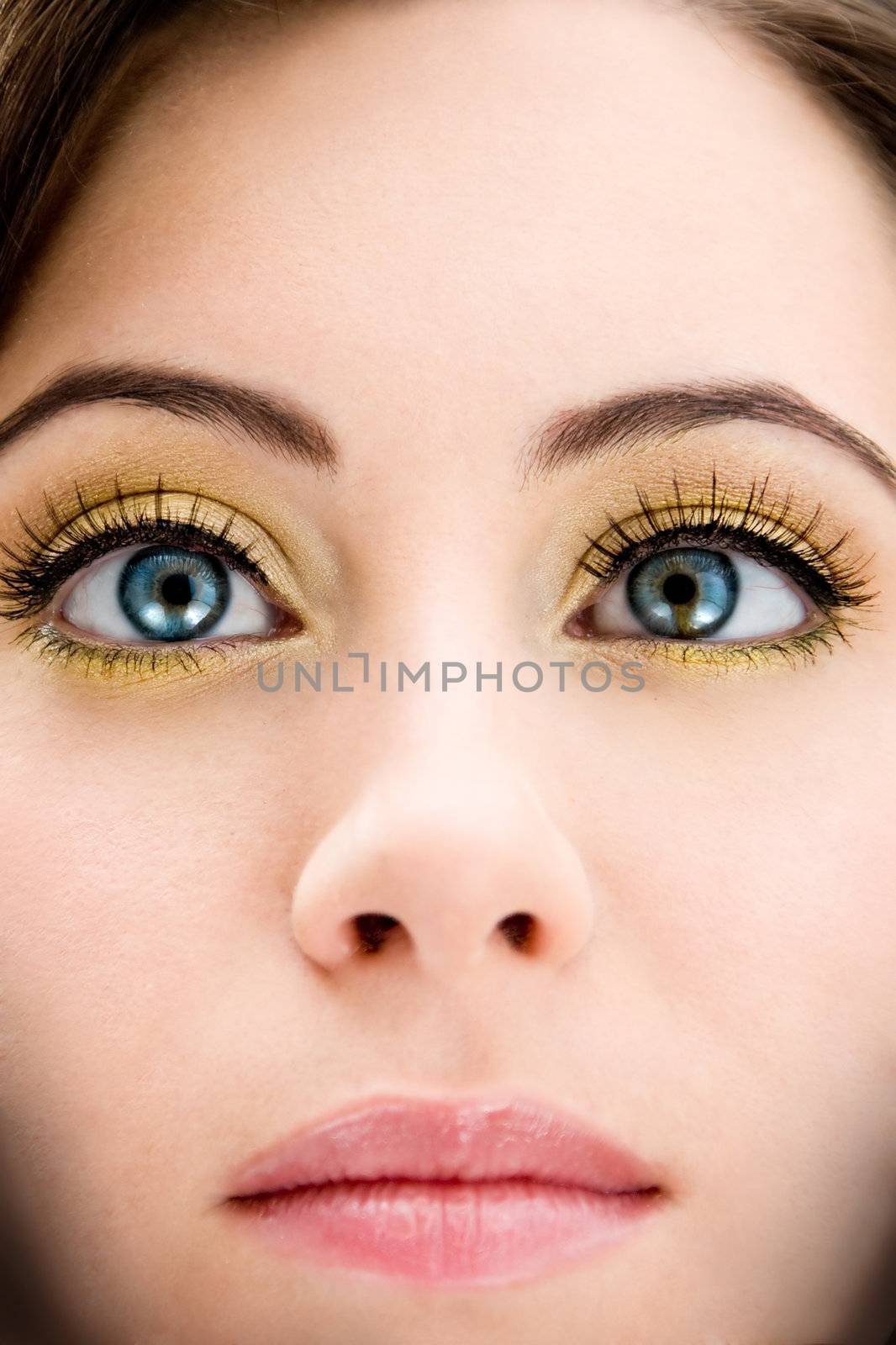 Face of a beautiful blue eyed brunette