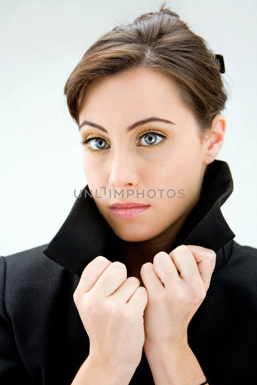 Face of a beautiful blue eyed brunette, isolated