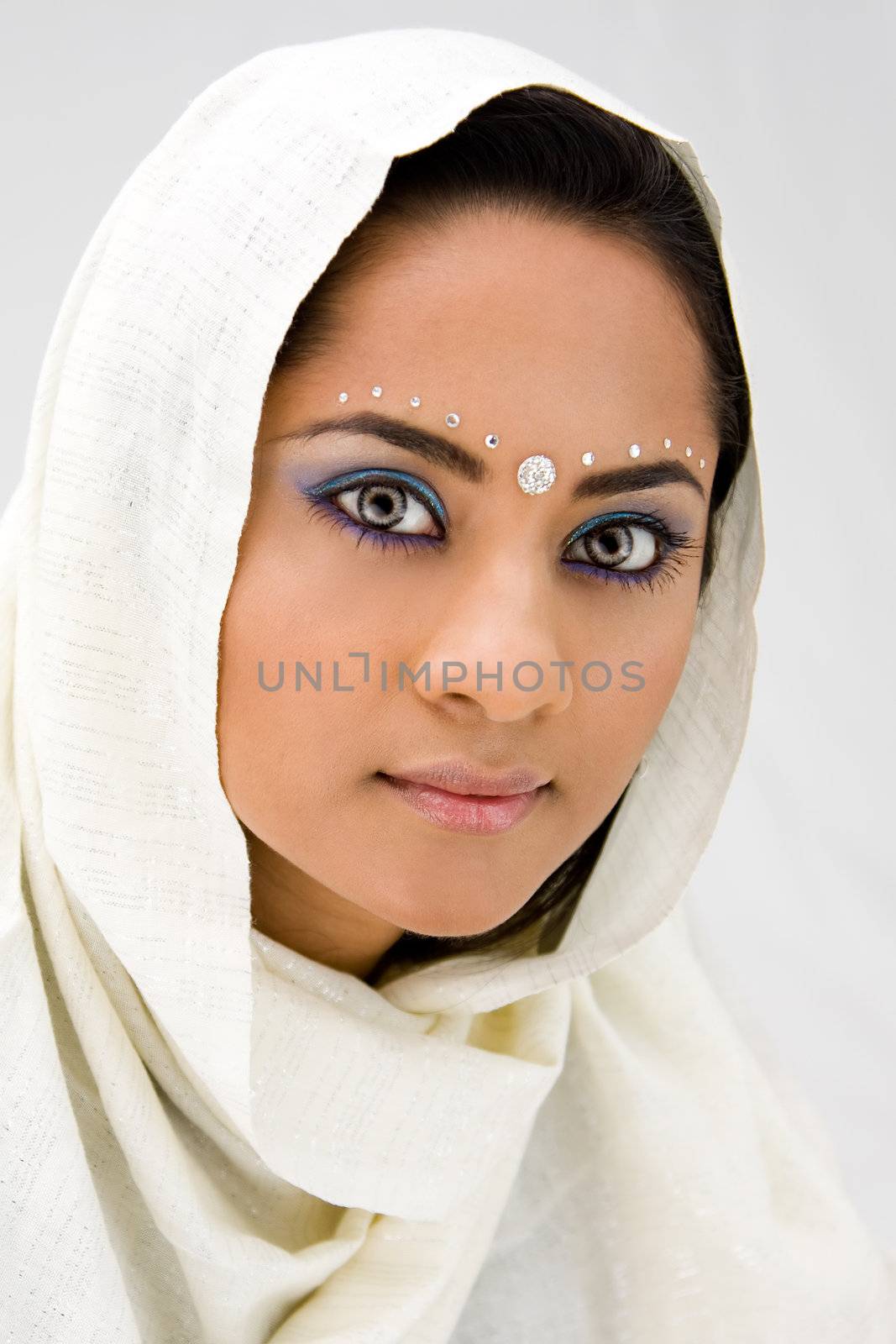 Beautiful woman with white head scarf, isolated