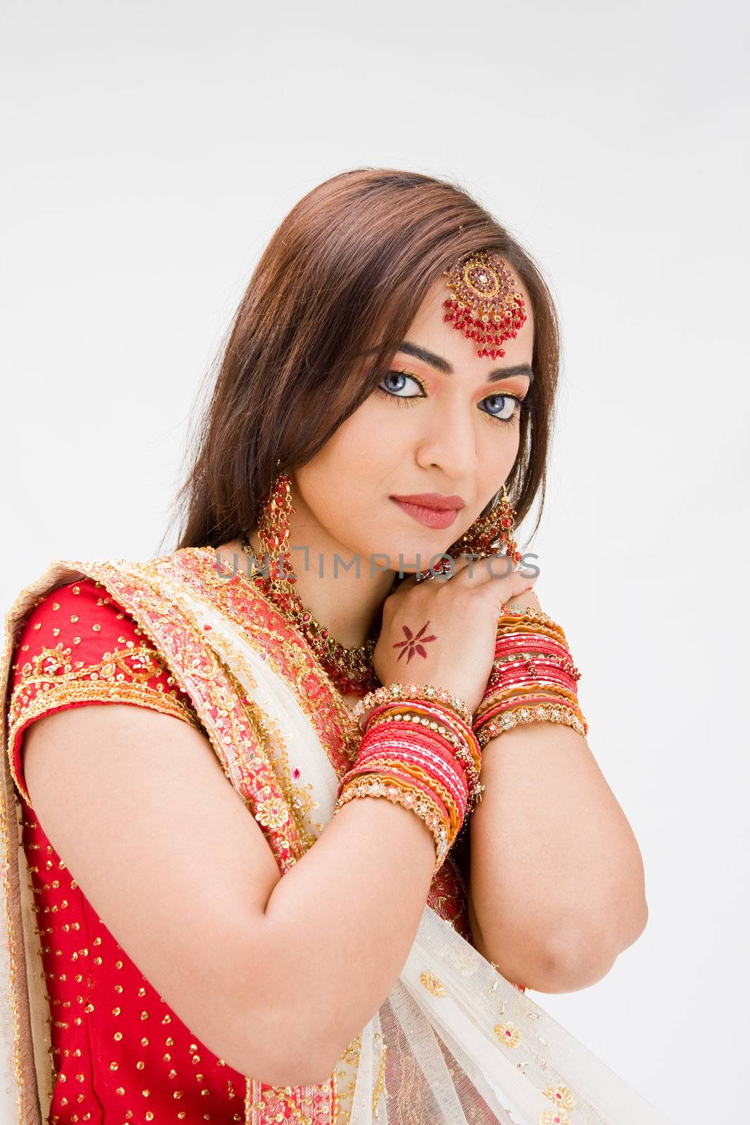 Beautiful Bangali bride in colorful dress, isolated