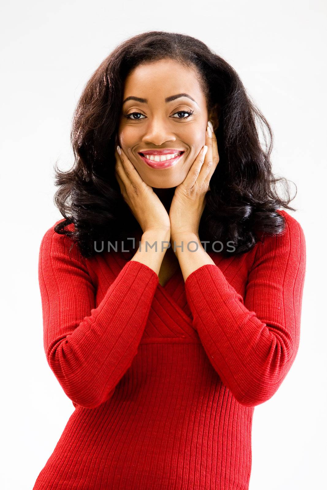 Beautiful African woman standing with hands cheeks and smiling, isolated