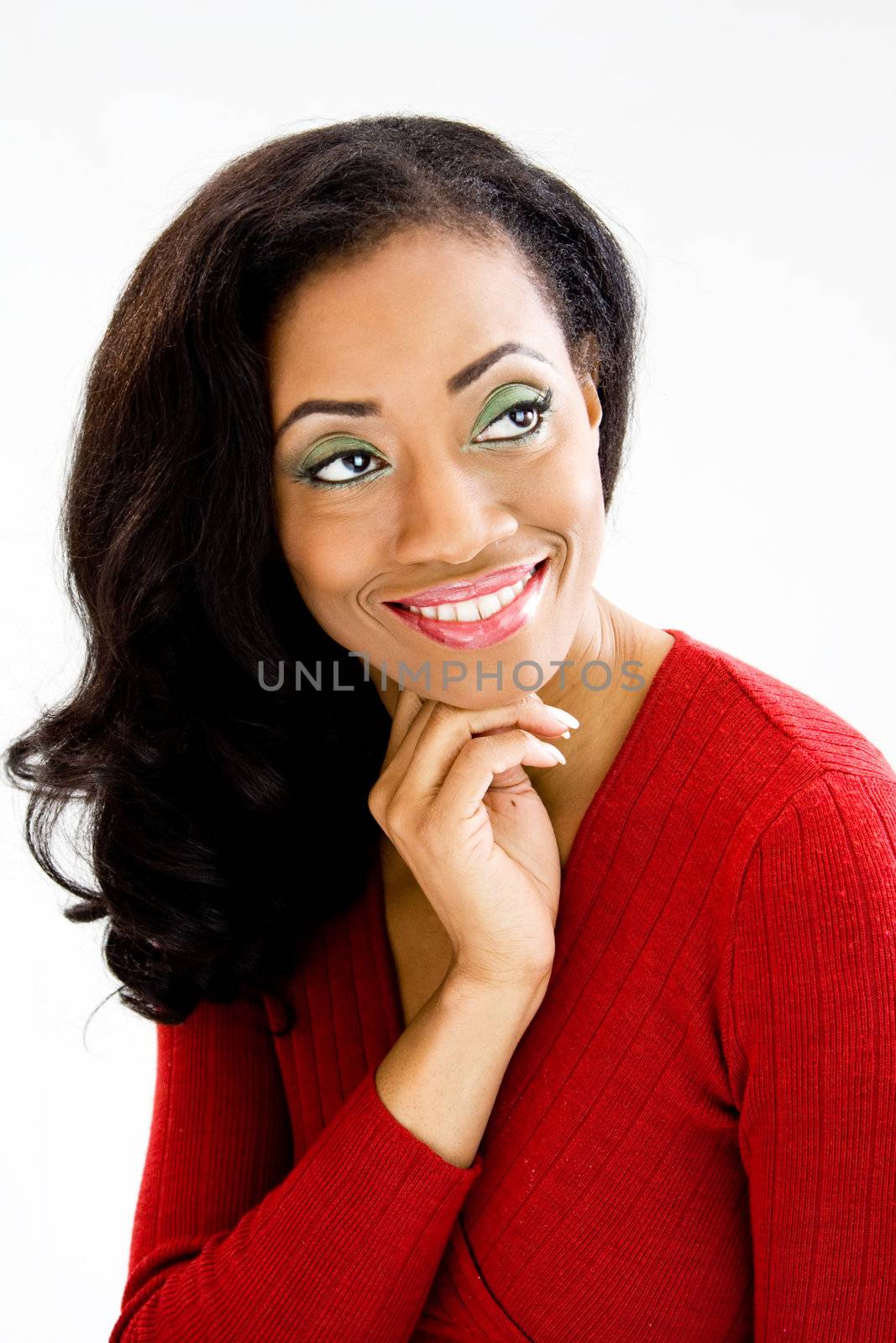 Face of beautiful African woman with hand under chin and smiling