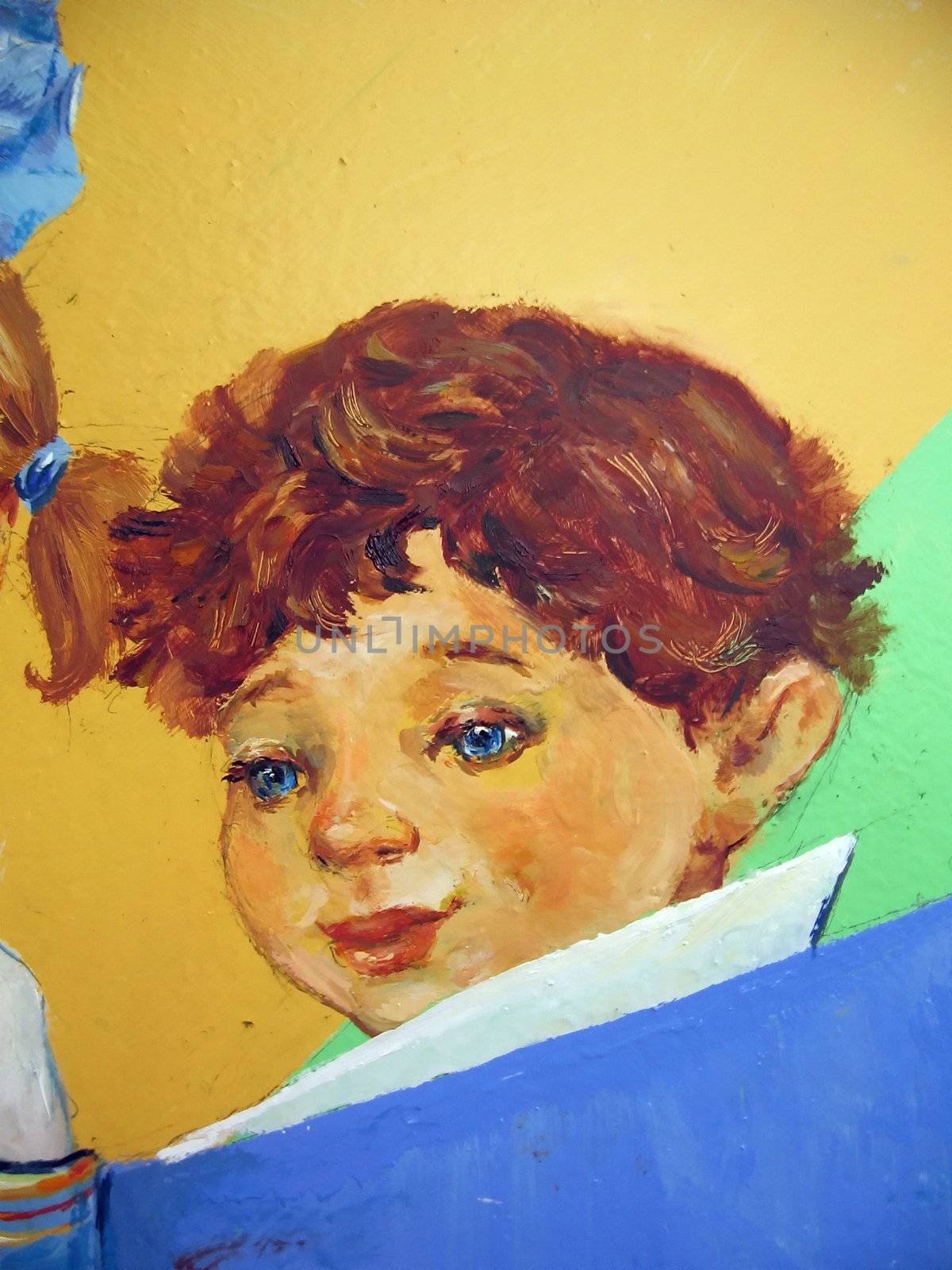 Painted on the colored wall boy which reads book