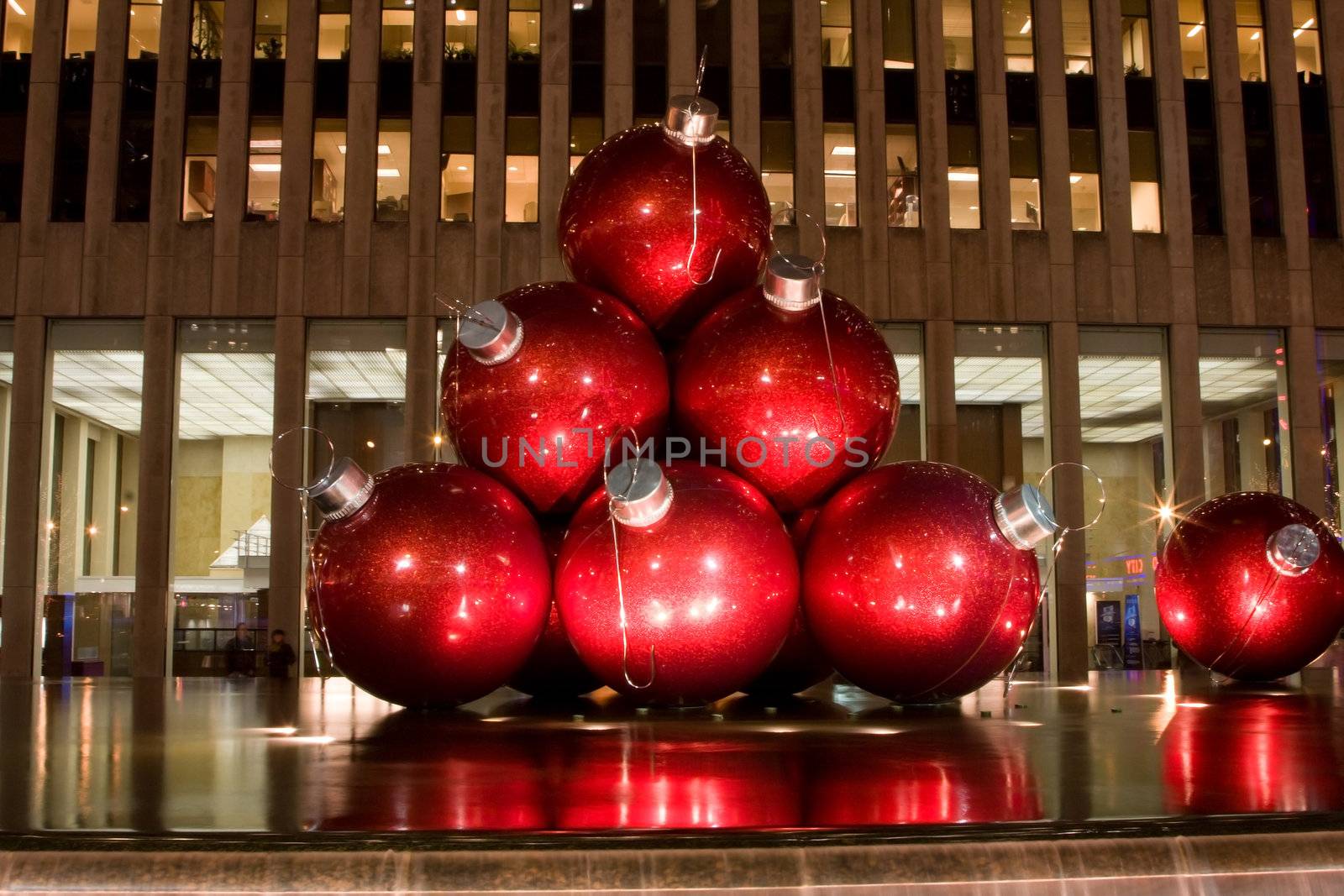 Big red balls as ornaments for the Christmas tree as an art exhibit on 6th Avenue in New York City