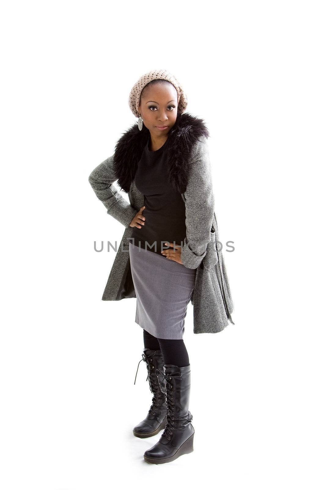 Beautiful African woman wearing gray winter wear, isolated