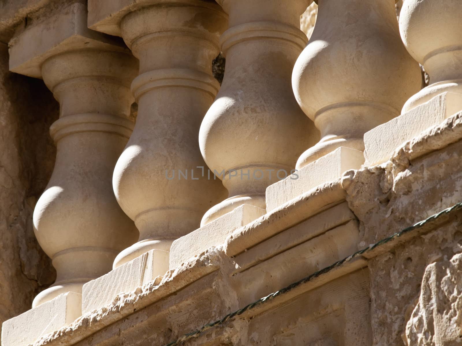 Detail of stone balustrades on a balcony in Malta
