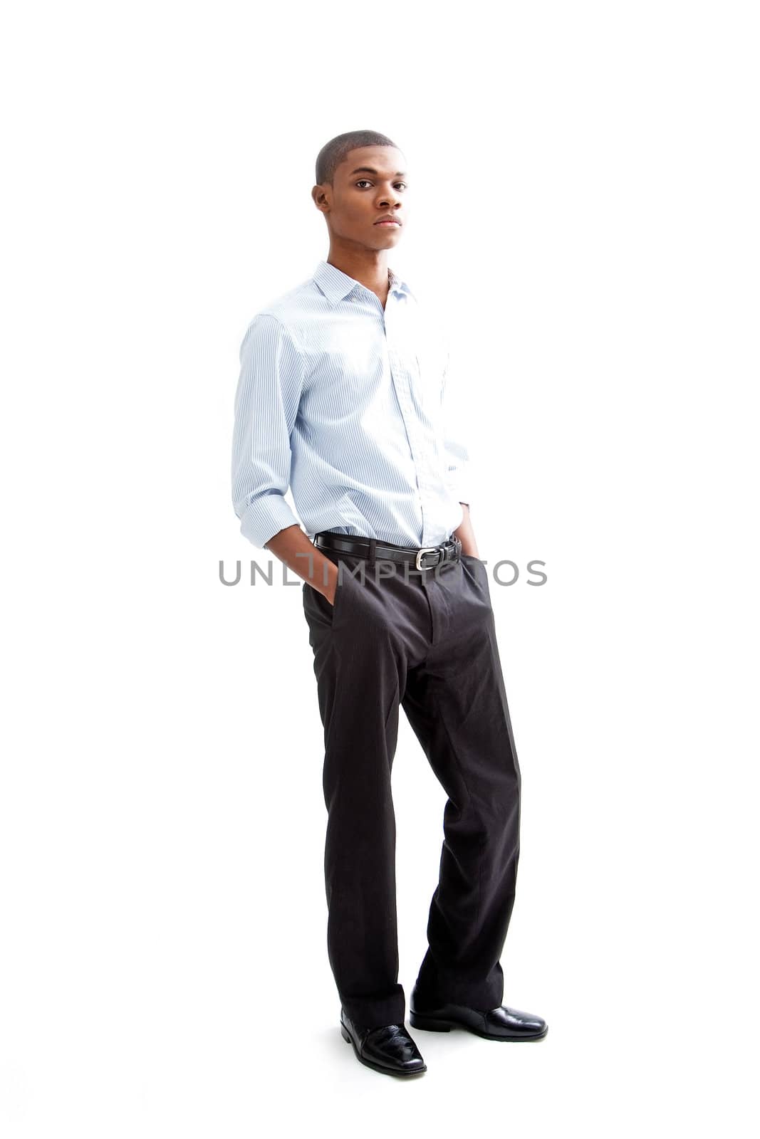 Young African business man standing relaxed and secure with hands in pocket, isolated