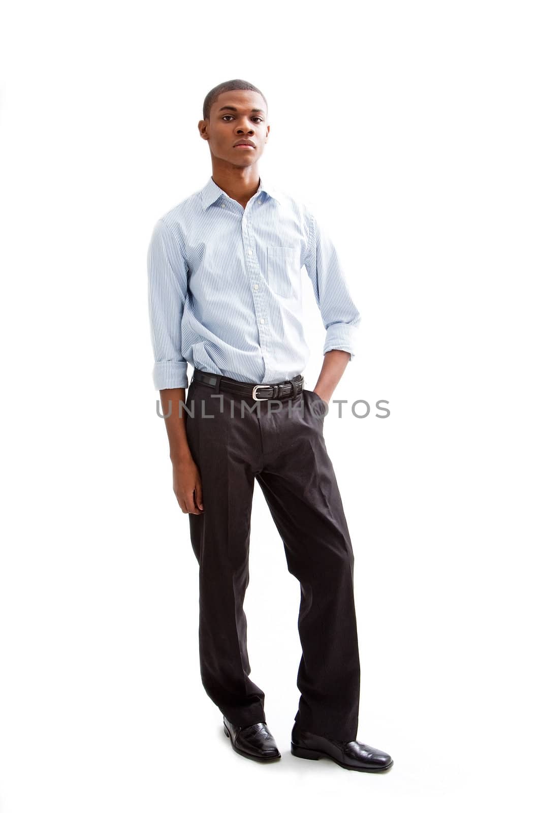 Young African business man standing relaxed and secure with hands in pocket, isolated