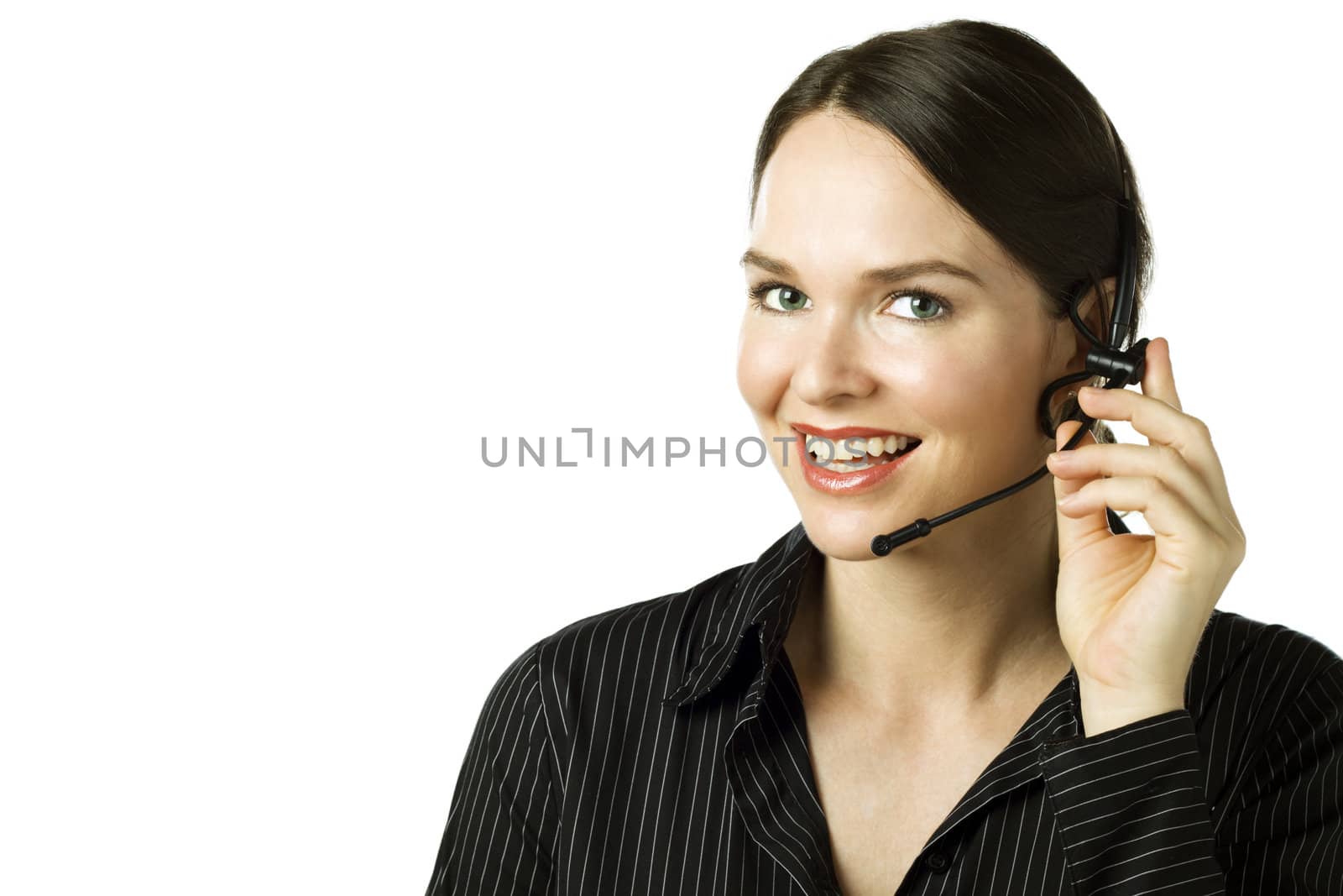Friendly smiling telephone operator/secretary with headset over white