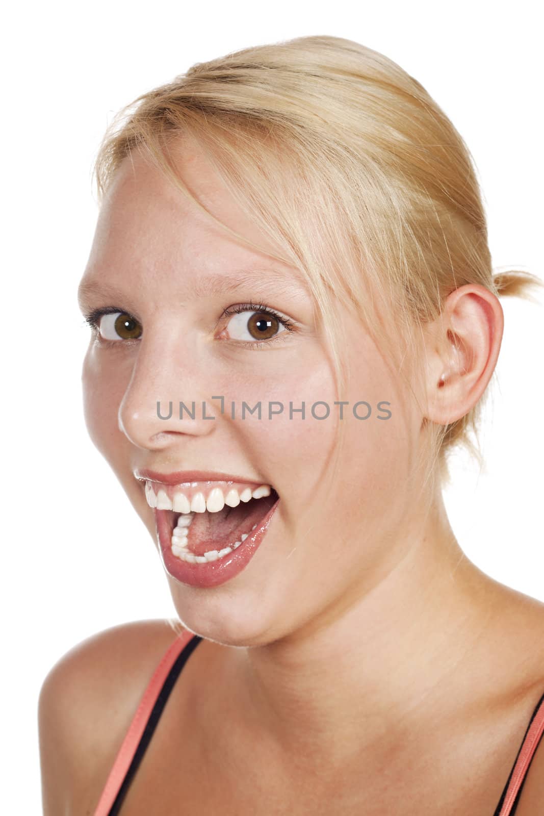 A close-up studio portrait of an attractive blonde young woman. Isolated over white