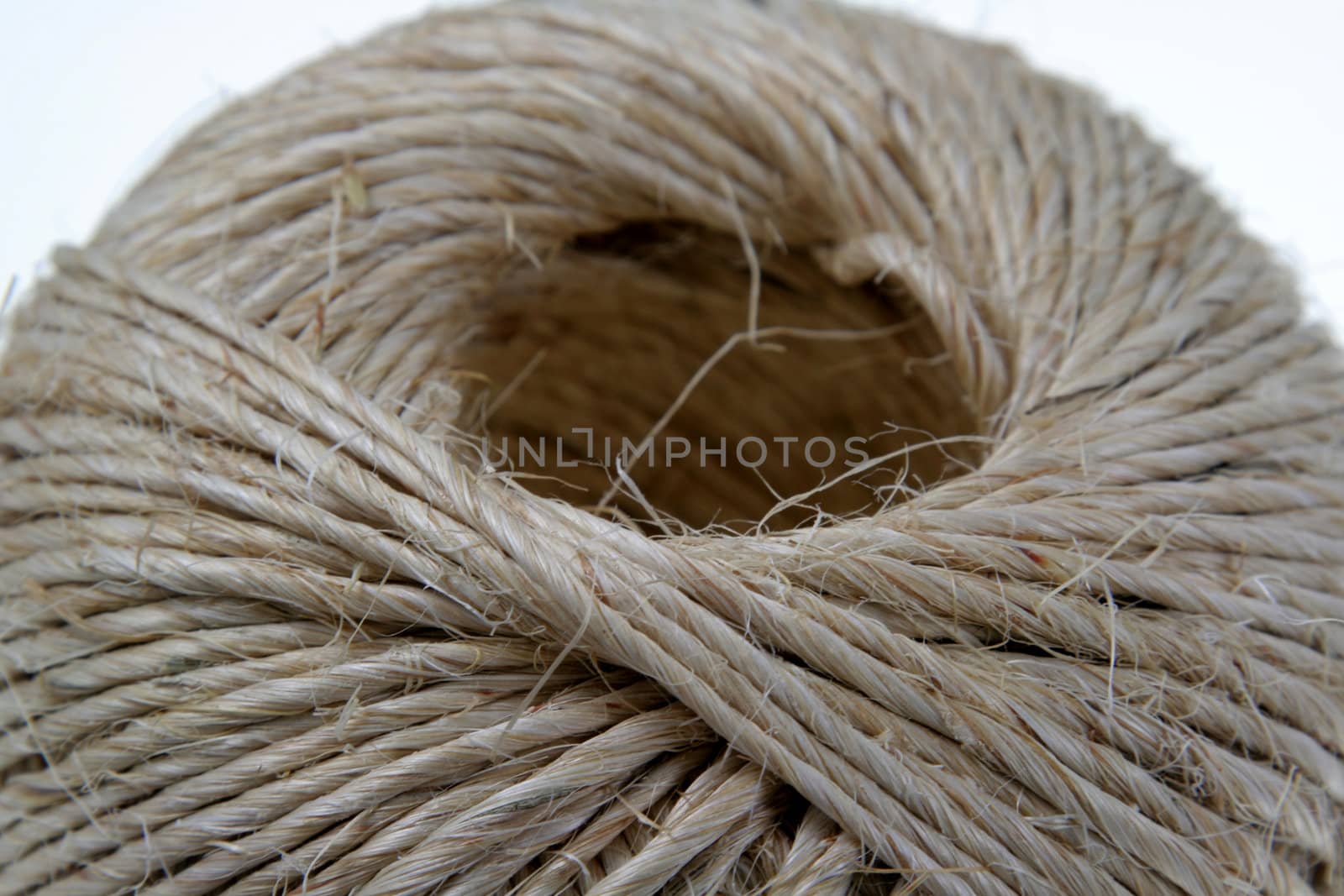 A ball of coarse string isolated on white.
