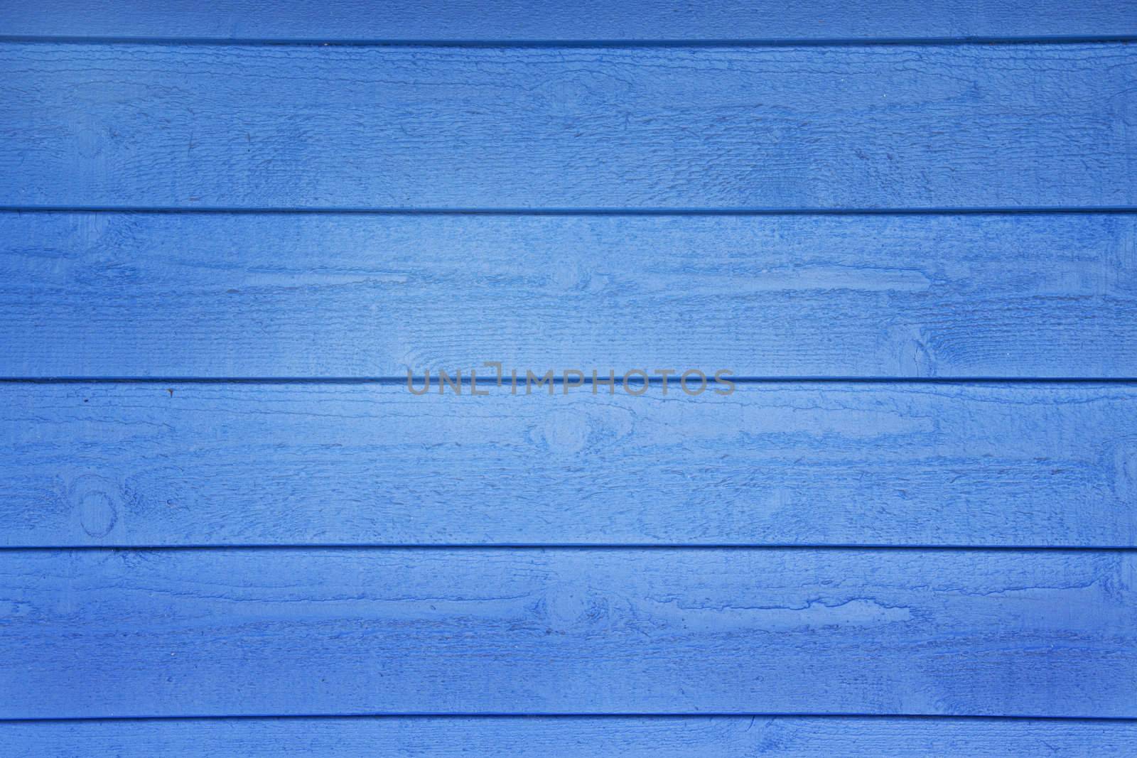 A blue wooden wall with horizontal planks