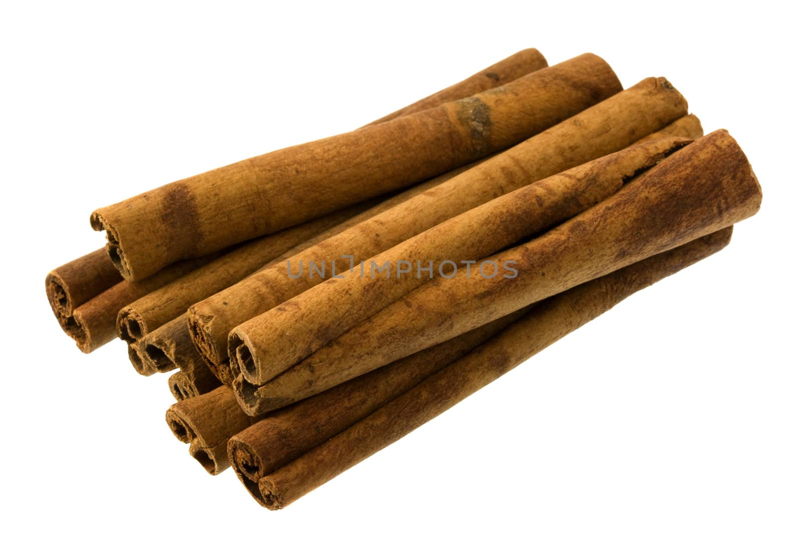 pile of cinnamon sticks isolated on white background