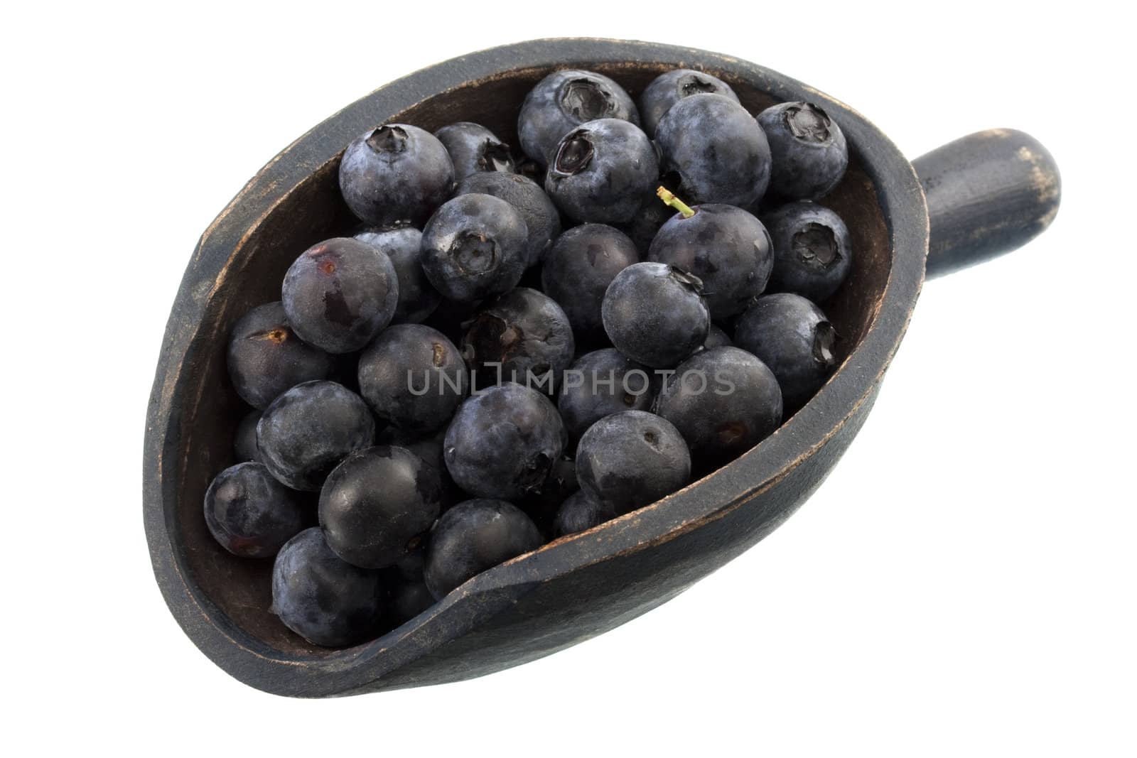 fresh blueberries on a rustic wooden scoop, isolated on white