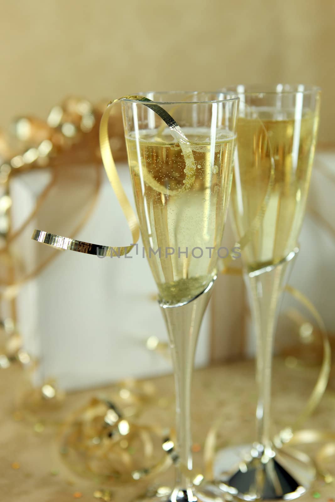 Closeup of Champagne Flutes With Party Items All Around