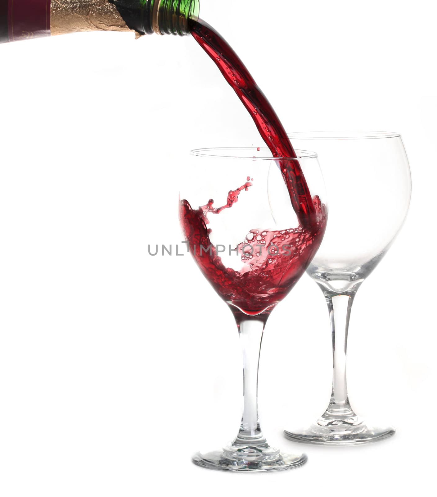 Merlot Red WIne Pouring into a Glass on White Bakcground