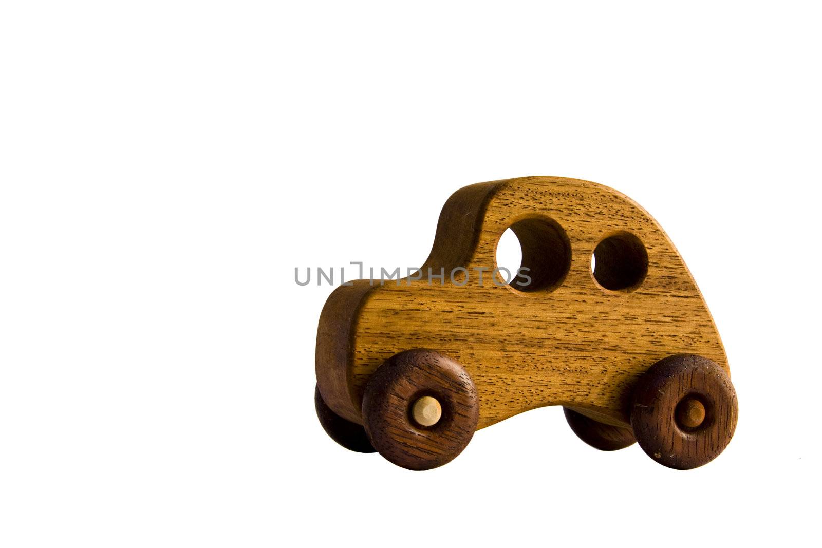 A funky wooden retro toy car over white with clipping path