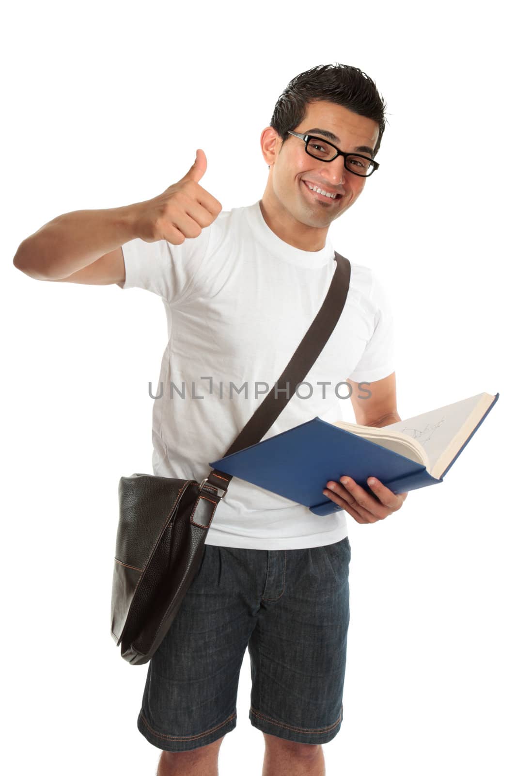 An excited happy university or college student, holding a text book and with thumbs up approval success, hand sign gesture.  White background.