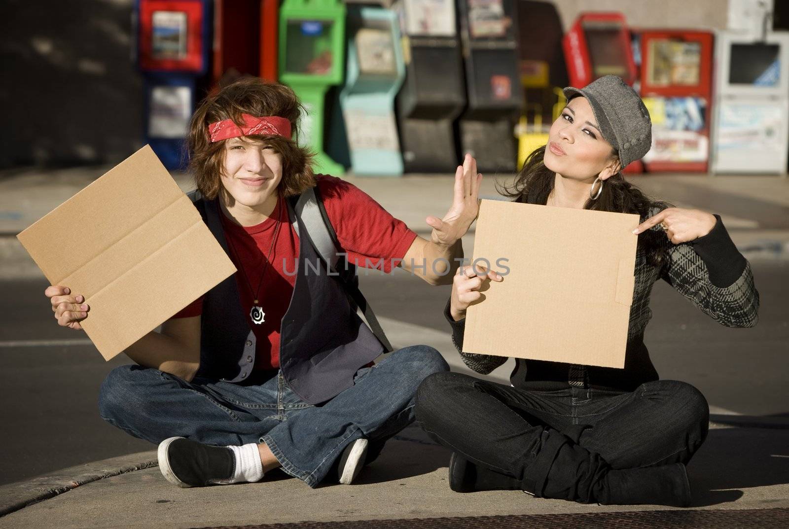 Young Man and Woman with Blank Cardboard Signs by Creatista