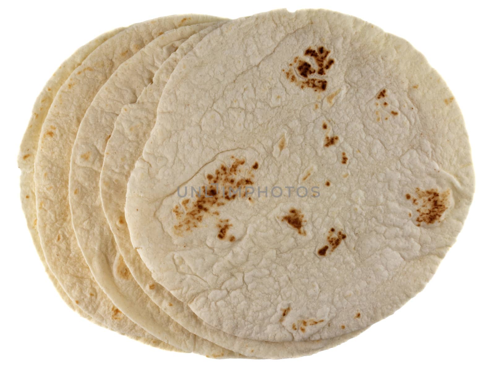 stack of wheat flour tortillas isolated on white