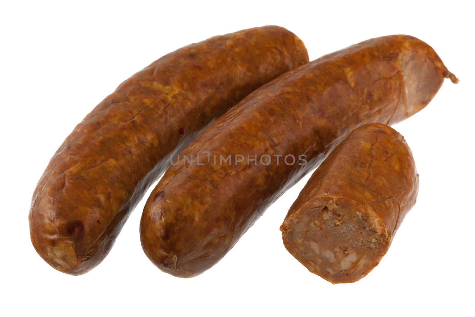 three pieces of North American (Mexican) cooked chorizo sausage isolated on white