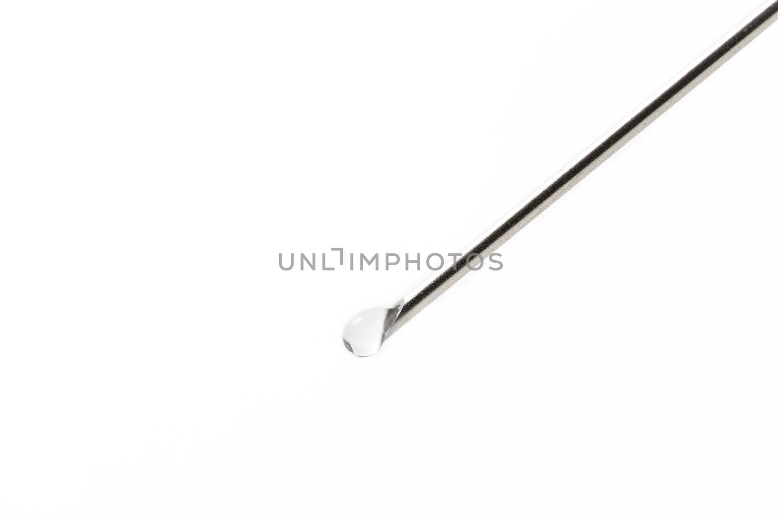 needle with liquid drop on white background