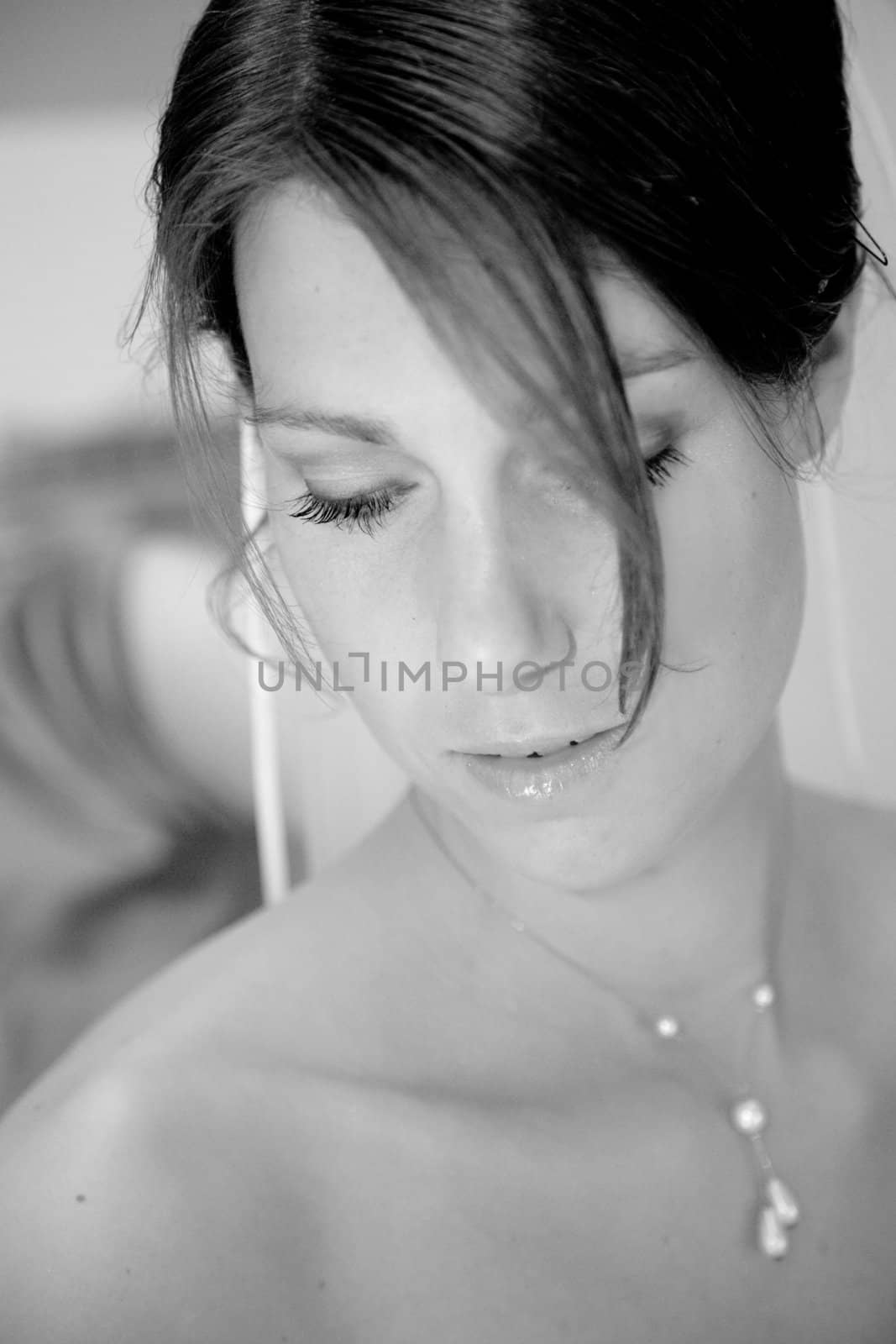 Beautiful bride having a quiet moment for the ceremony