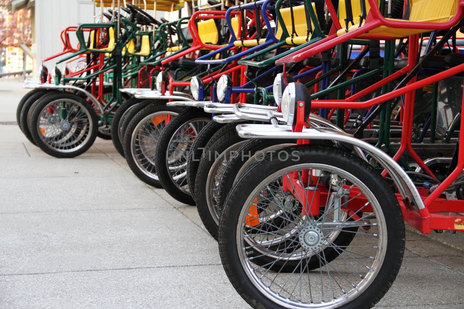 A row of bicycles waiting to be rented.