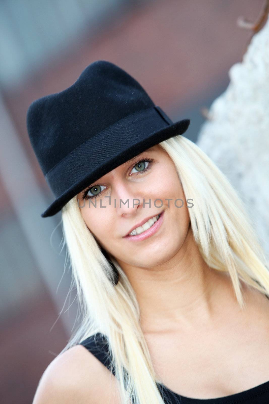 young, smiling blond woman with a hat by Farina6000