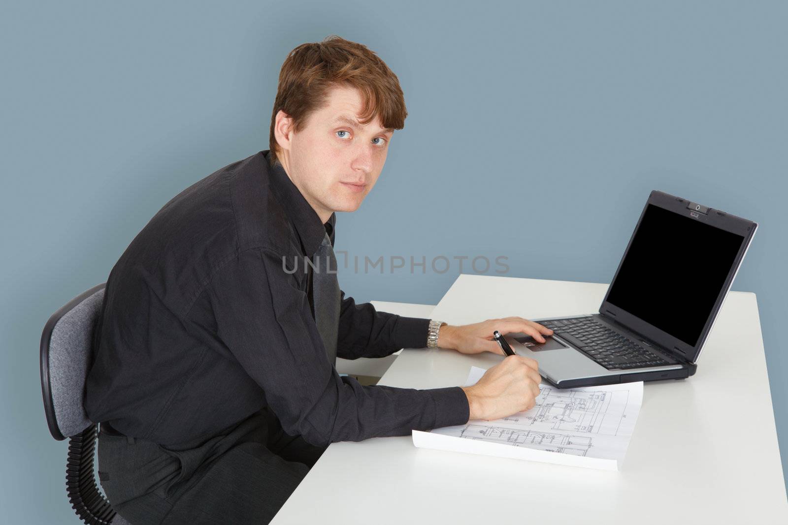 The young specialist working on a project in the office