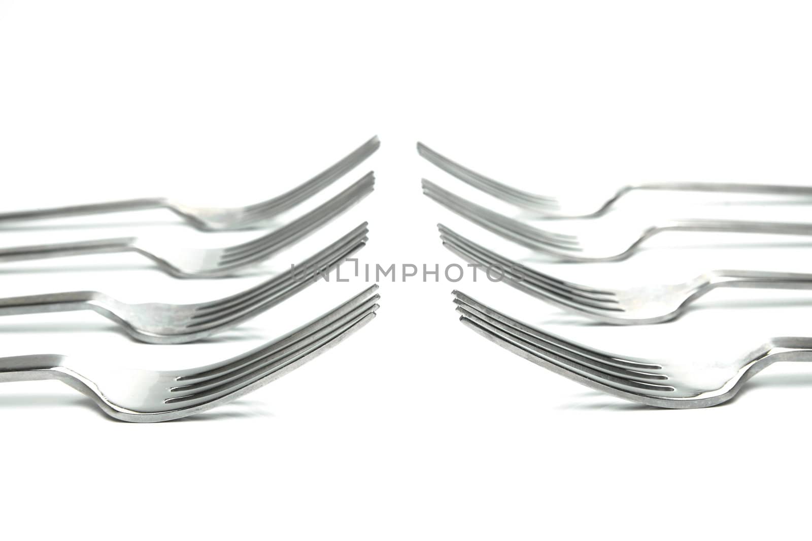 Silver table forks isolated against a white background