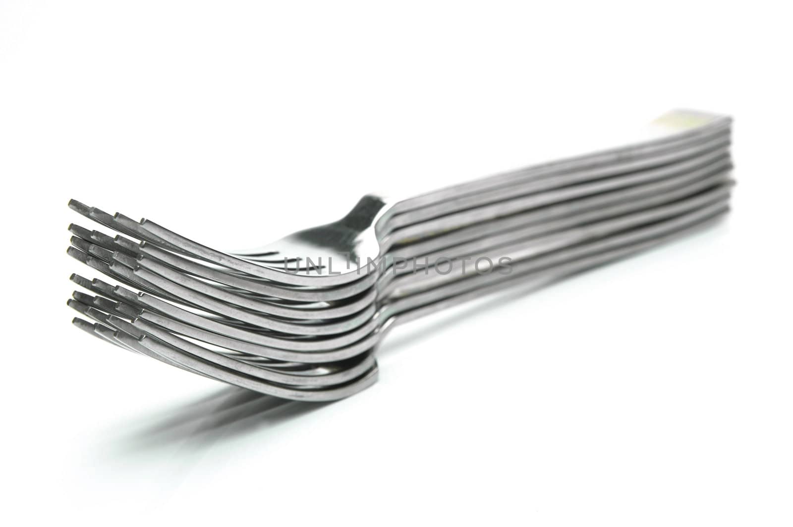 Silver table forks isolated against a white background